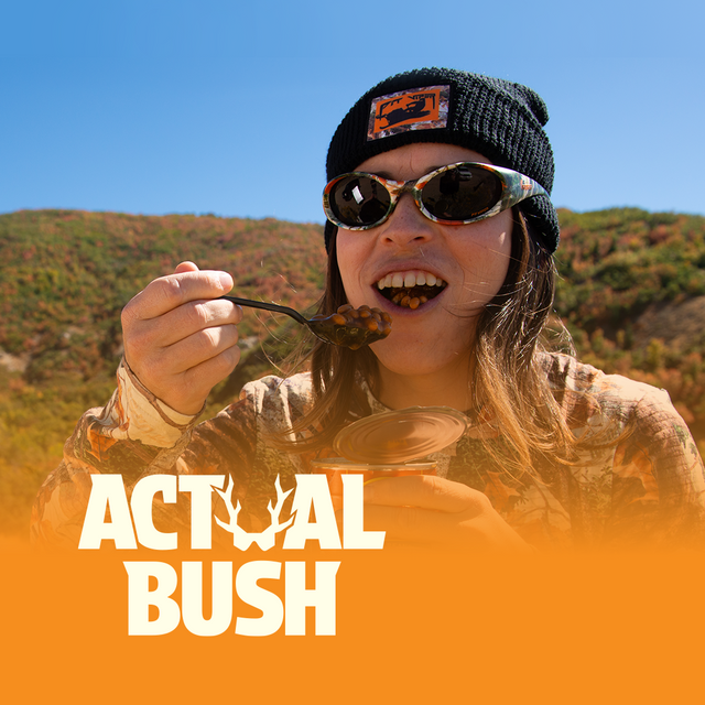 Actual bushes baked beans being eaten by a person wearing actual bush camoflage shirt and sunglasses. At least I think it's a person. can't really see them because they blend so well into the background.