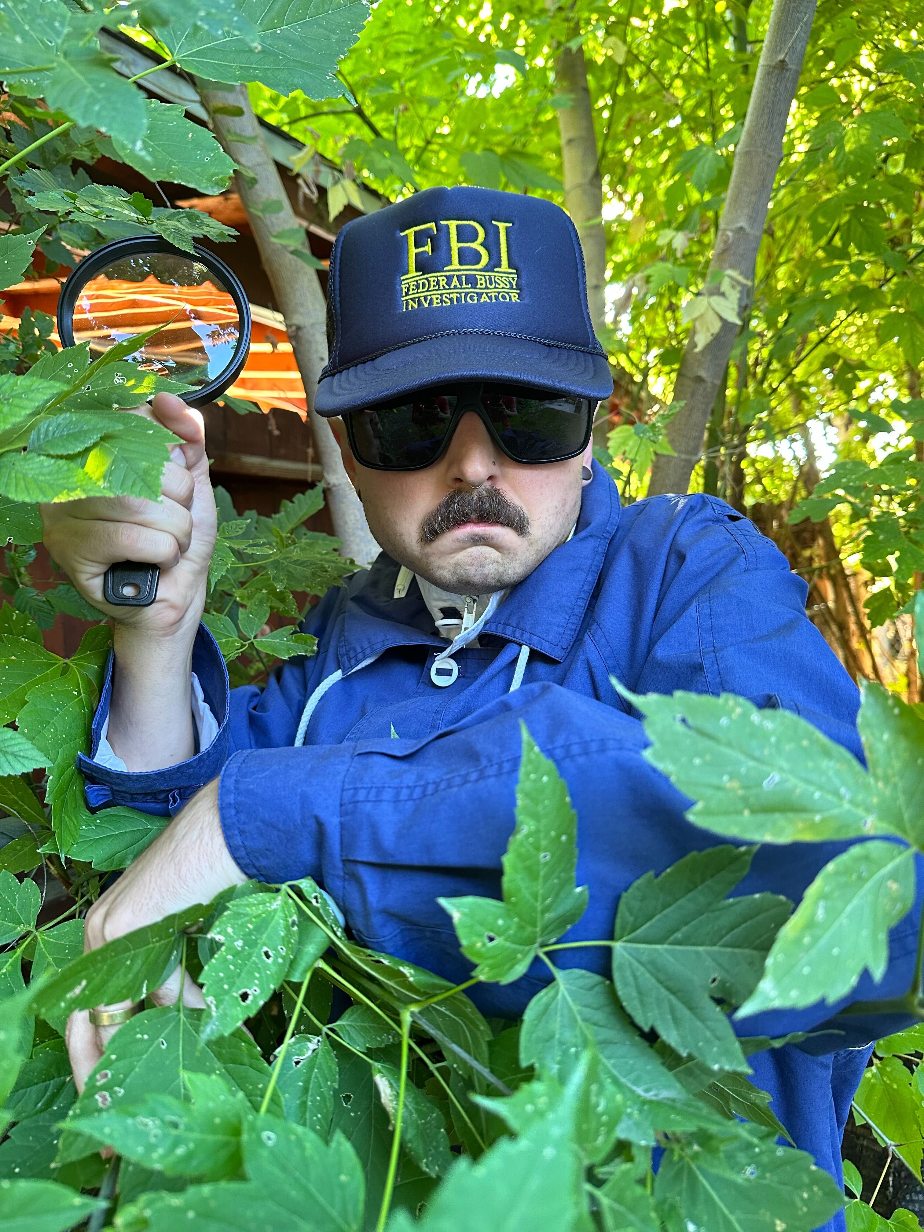 Lexica - fbi agent with a close shaved beard wearing and fbi hat with  reflective sunglasses